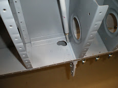 Aileron push/pull tube hole
