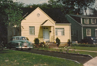 The Dixon home on Thompson Ave., Roselle, NJ. 1953. A little yellow house with flowers all around!