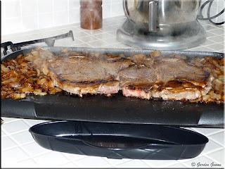 T-bone steaks cooked on griddle