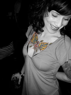 Beautiful flowery chest tattoo on woman