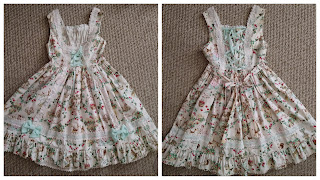 From and back of the JSK. Has mint green accents. The print has images from the snow white fairy tale including the dwarves, mushrooms, Snow White, the cottage and forest animals.