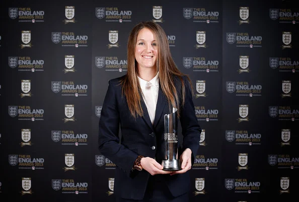 Casey Stoney poses with the 2013 Club England Team of the Year award