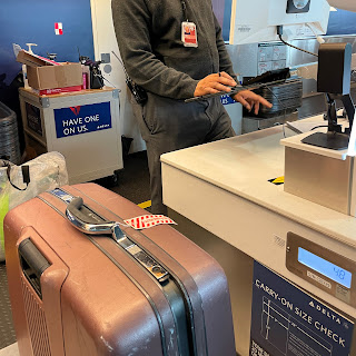 Checking our big, pink Samsonite bag which weighed in at 48 lbs