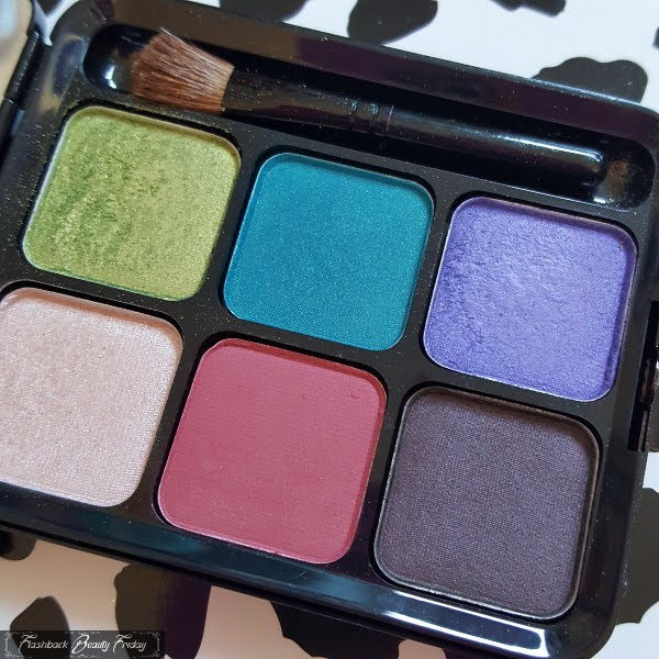 6 pan eyeshadow palette in bright shades with small brush