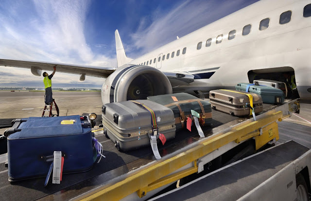 loading baggage onto an airplane