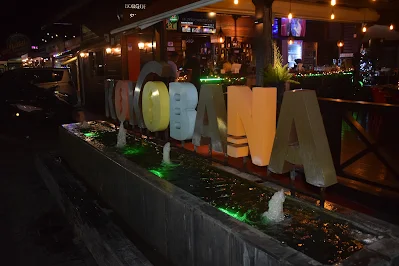 "Water fountain with restaurant's Kokobana logo in Paramaribo Noord"