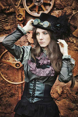 An example of swiss waist belts used in women's steampunk fashion. This woman is wearing her swiss waist belt with a blouse, skirt, top hat and goggles.