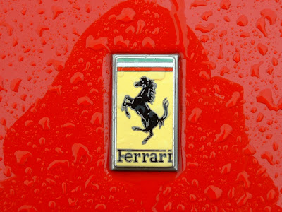 red ferrari logo on car with water drops wallpaper