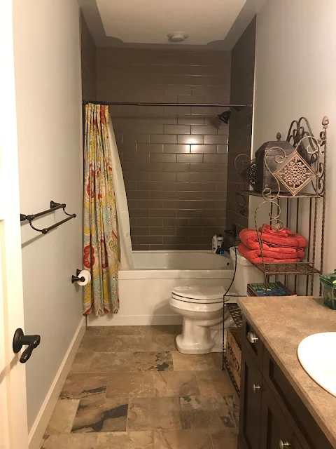 Short shower curtain makes bathroom feel smaller 