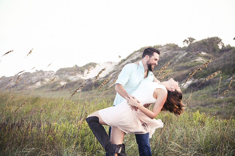 Amy and David West being playful on the beach