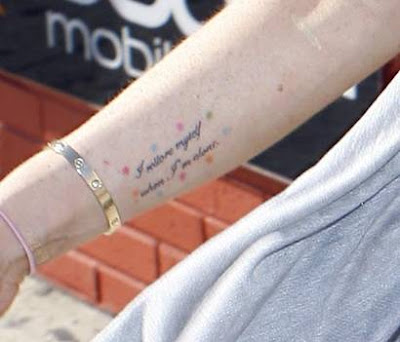 New tat seen below on her bony wrist with a Cartier Love bracelet: