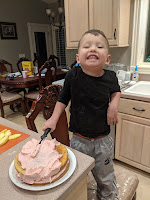 Joseph baking and frosting a cake, just because.