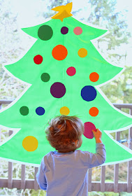 Sticky Kid-Sized Christmas Tree with reusable ornaments - you can decorate all season long!  From Fun at Home with Kids