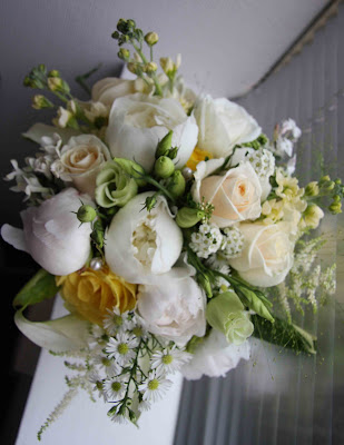 Hand tied vintage style bridal bouquet in sumptuous shades of creams golds