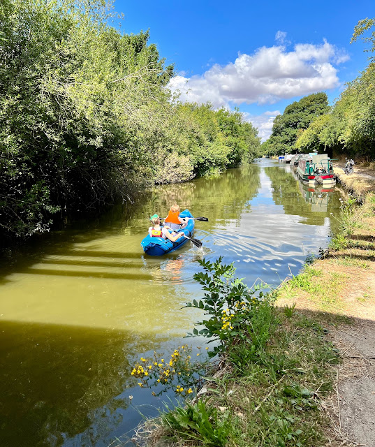 madmumof7's children in inflatable kayak on canal