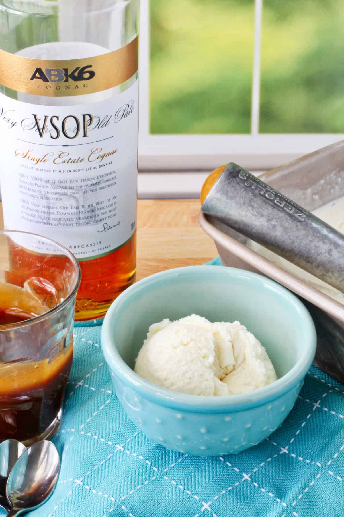 Cognac Ice Cream in a blue bowl on a blue dish towel.