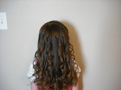Or you can turn it into a curly Barbie hairdo. I prefer to curl it when we 