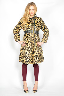 Vintage 1960's faux fur leopard peacoat with button front closure and black leather belt.