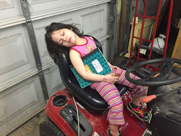 15+ Hilarious Pics That Prove Kids Can Sleep Anywhere - Napping On The Riding Lawn Mover. Amazing That She Can Still Hold On To Her Book And Crayons