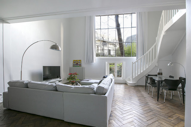 Living room of Paris apartment on private Avenue Frochot seen on Hello Lovely Studio