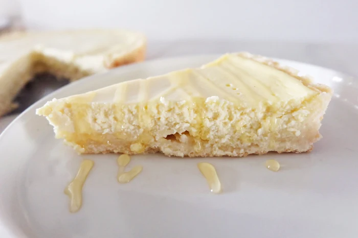 side view of sliced Greek yogurt cheesecake tart