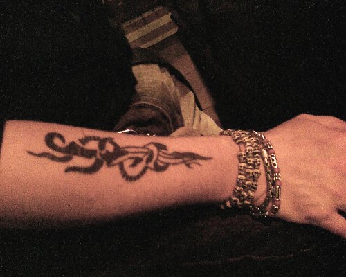 Dagger tattoo on forearm
