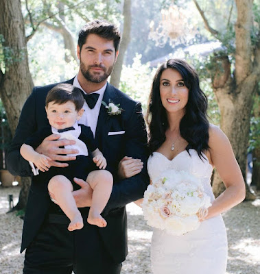 Nick Bateman with his wife Maria & son in their wedding dress