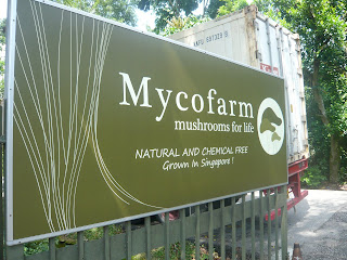 signboard with Mycofarm name at entrance to farm