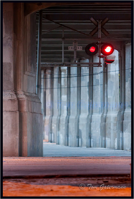 Crossing signals flash under the 12th Street Viaduct in the West Bottoms of Kansas City.