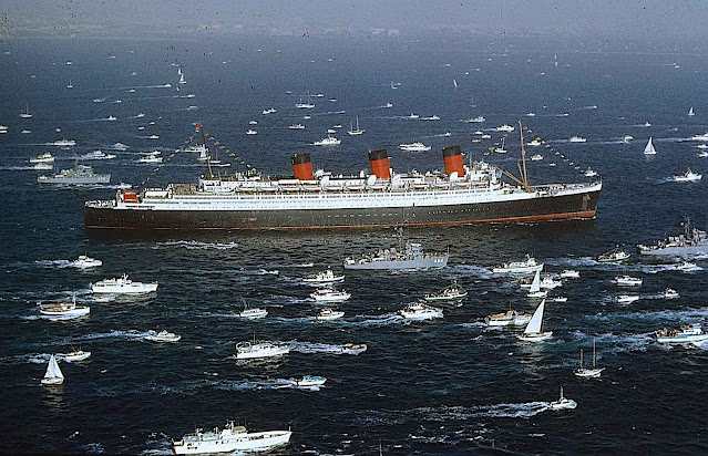 the Queen Mary ship with many escort boats