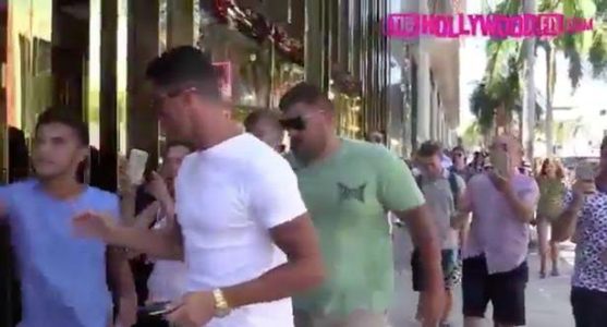 Cristiano Ronaldo pushes aside selfie seeking fan who tried interrupt his shopping trip (photos/video) 