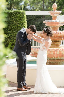 groom kissing brides hands