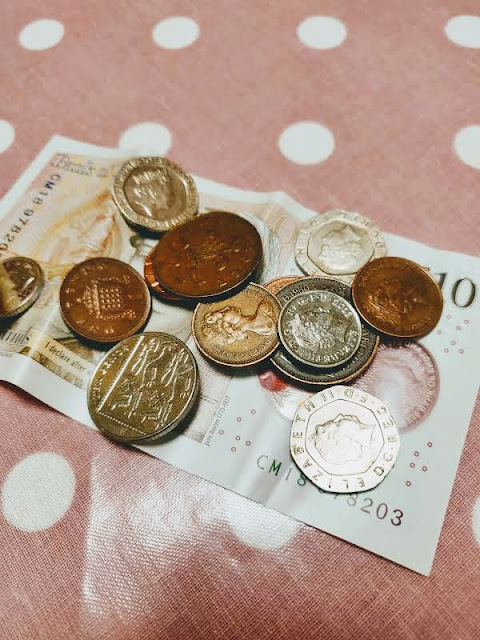 Sterling cash on tablecloth