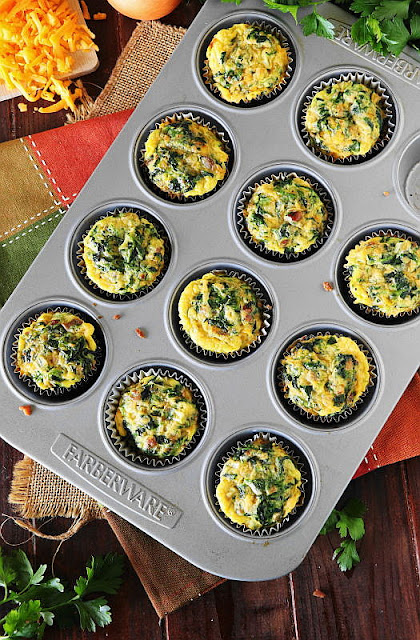 Top View of Make-Ahead Bacon & Spinach Quiche Cups in Muffin Pan Image