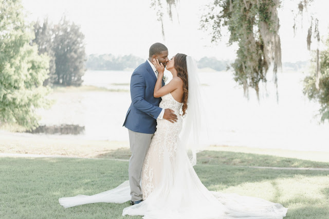 bride and groom kissing at lake mary events center