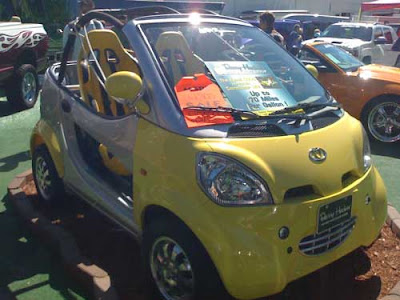 Yellow futuristiclooking mini car There were a lot of alternative vehicles