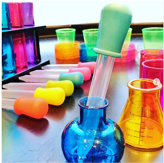 potion making tuff tray idea with test tubes and pipettes