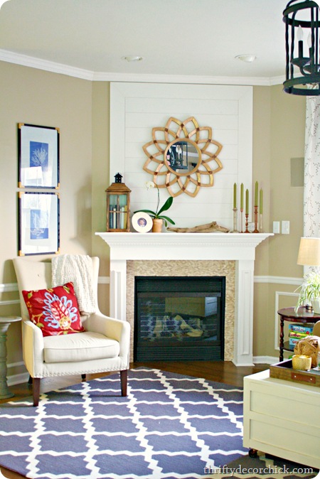 wood plank wall fireplace starburst mirror