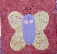 applique butterfly on a wall hanging