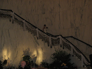 The bride descends the staircase