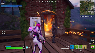 Trailblazer Lynx blows up a small room full of Objects in Fortnite.