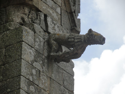 medieval roof spout shaped like a lamb, seems, on an old church in France