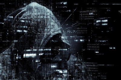 Photo collage portraying a computer hacker