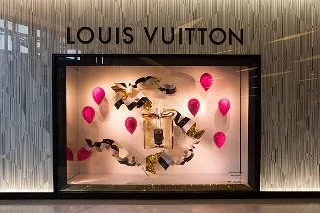 Louis Vuitton's brand history in heritage window displays