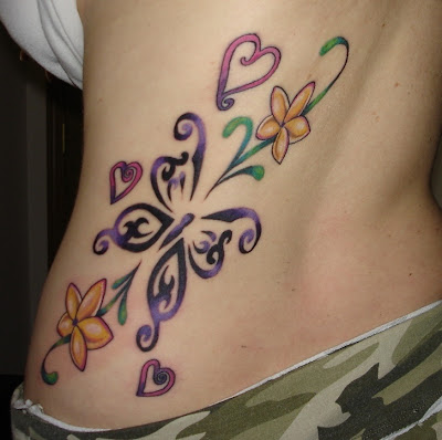 tattoo on girls ribs. butterfly tattoo flower rib