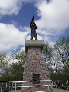 a metal scuplture depicting Chief War Eagle sits atop a stone monument at War Eagle Park in Sioux City, Iowa