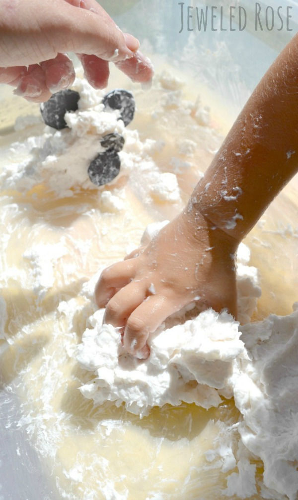 Take a break from traditional play dough and make ghost mud instead!  It's icy-cold, and oh-so-fun! #ghost #ghostmud #ghostmudrecipe #ghostartprojectsforkids #ghostcraftsforkids #ghostrecipes #ghostplaydough #halloweenactivities #halloween #halloweenartsandcraftsforkids #growingajeweledrose #activitiesforkids