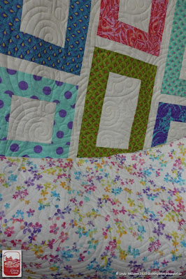 Framed Quilt by Much Love showing backing