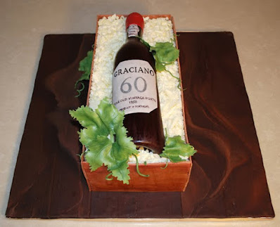 Top view of the sugar wine bottle sitting on top of a wooden crate box made of cake.