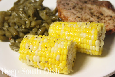 This super easy method of steaming corn uses un-husked corn, cooked in your microwave, and results in a clean cob with no silk left behind, and corn that is tender-crisp and ready to eat!